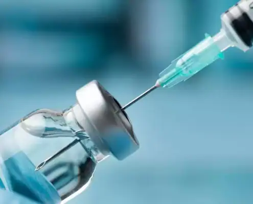 Peptide vial with syringe preparing to perform research